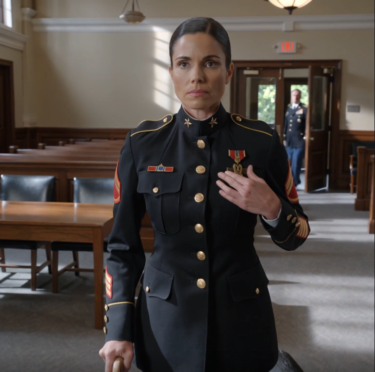 A judge ordered me to remove my Navy Cross in court. I touched the medal once, stood with my cane, and then the rear door clicked open. His face changed before I ever turned around.