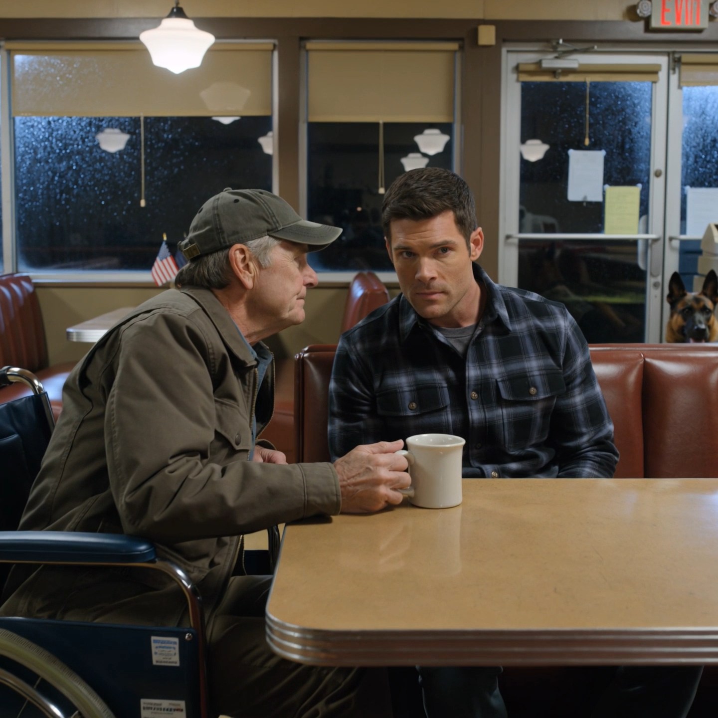 ‘Pretend you’re my grandson,’the old farmer in the wheelchair whispered to the Navy SEAL. The military dog was already on its feet. When three men came through the diner door, Jack never flinched — but thirty seconds later, the one speaking for all three was staring at a folded page in his hand like he had just walked into the wrong life.