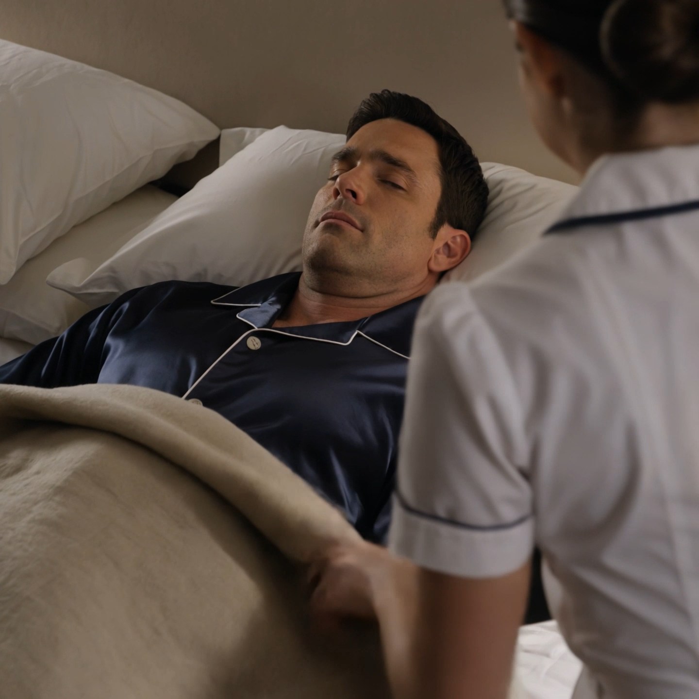 Rich CEO Ethan Caldwell pretended to sleep because he thought his new maid was hiding something. He expected to catch her stealing, snooping, or proving his suspicion right. Instead, she picked up the only photo of his late mother, whispered an apology, and did one quiet thing beside his bed that made him question every person he had ever trusted.